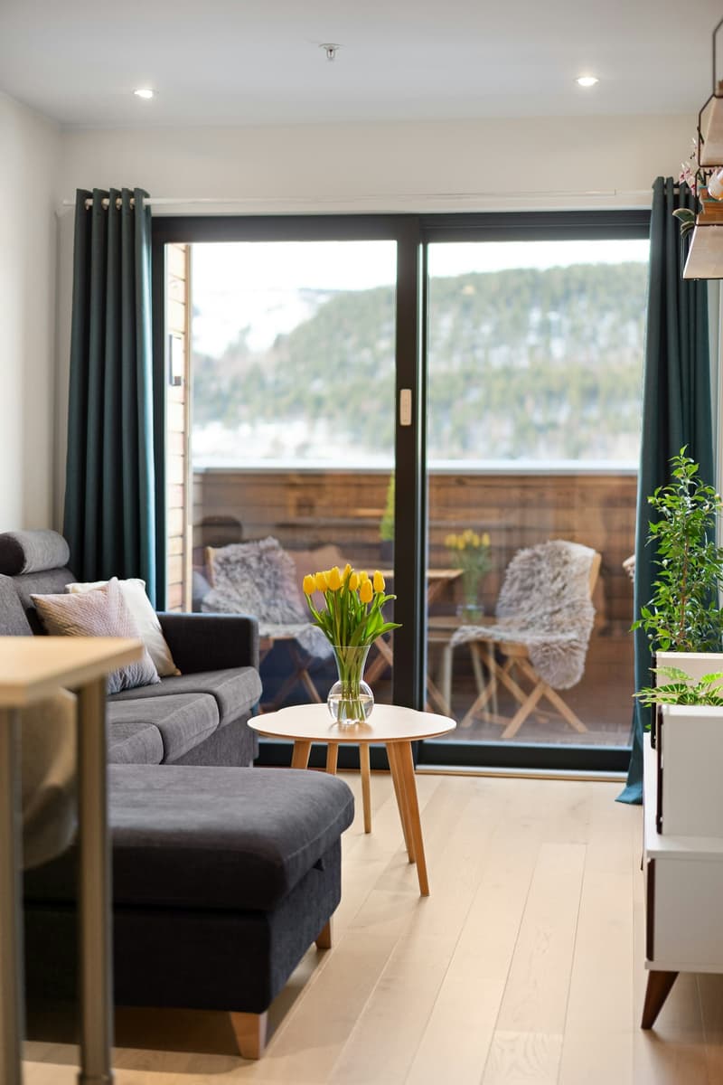 Living room with a sliding glass door opening onto a patio.